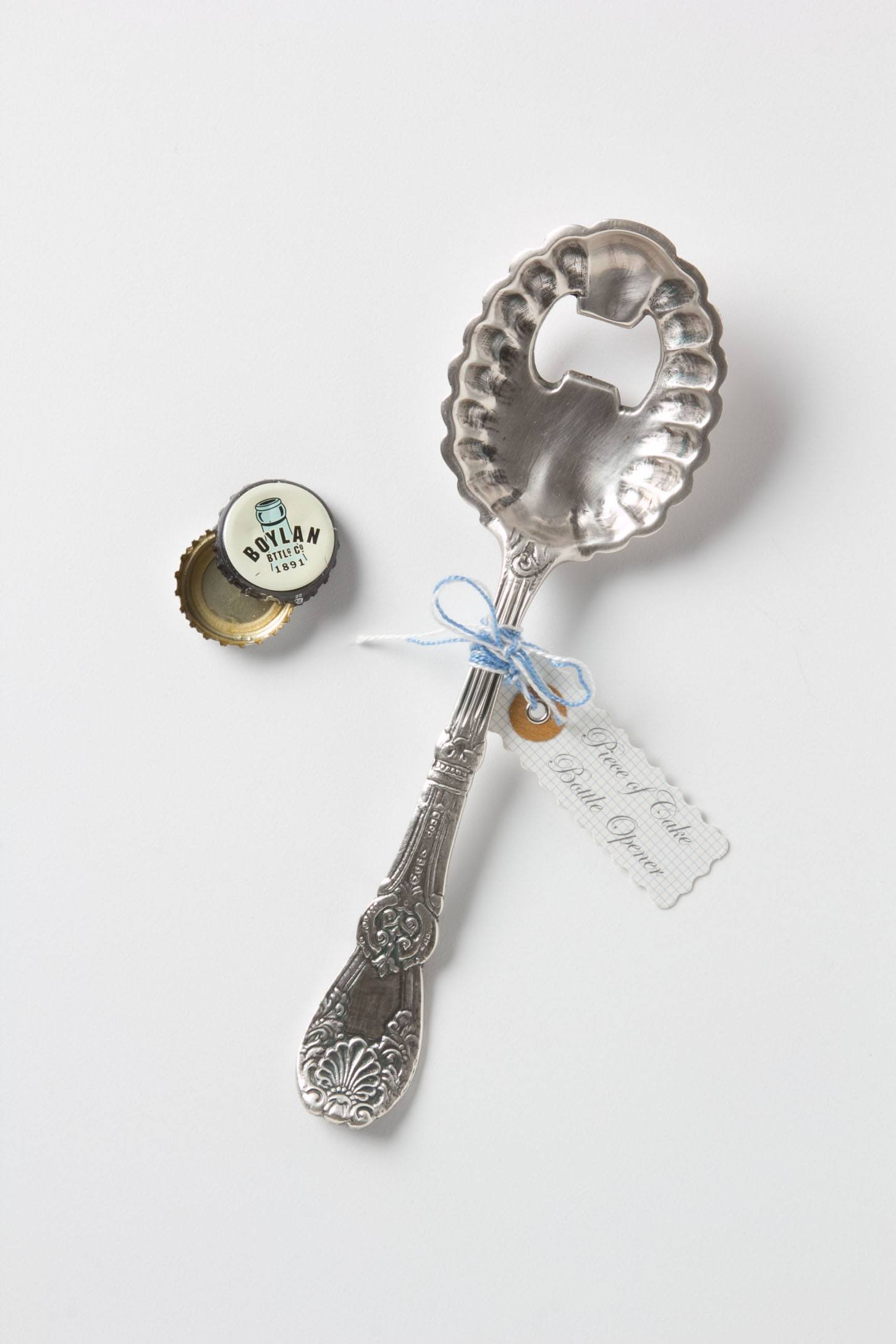Silver spoon bottle opener with bottle caps